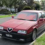 Red Alfa Romeo 164 Q4 front three-quarter view