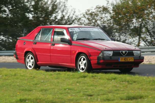 Red Alfa Romeo 75 representing the Rare and Performance Alfa Romeo hub