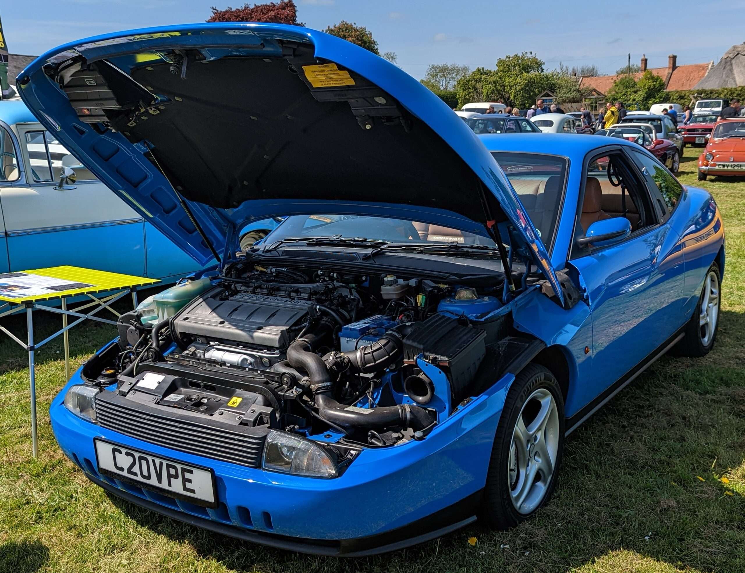 Red Fiat Coupé 20V Turbo representing the Rare and Performance Fiat hub