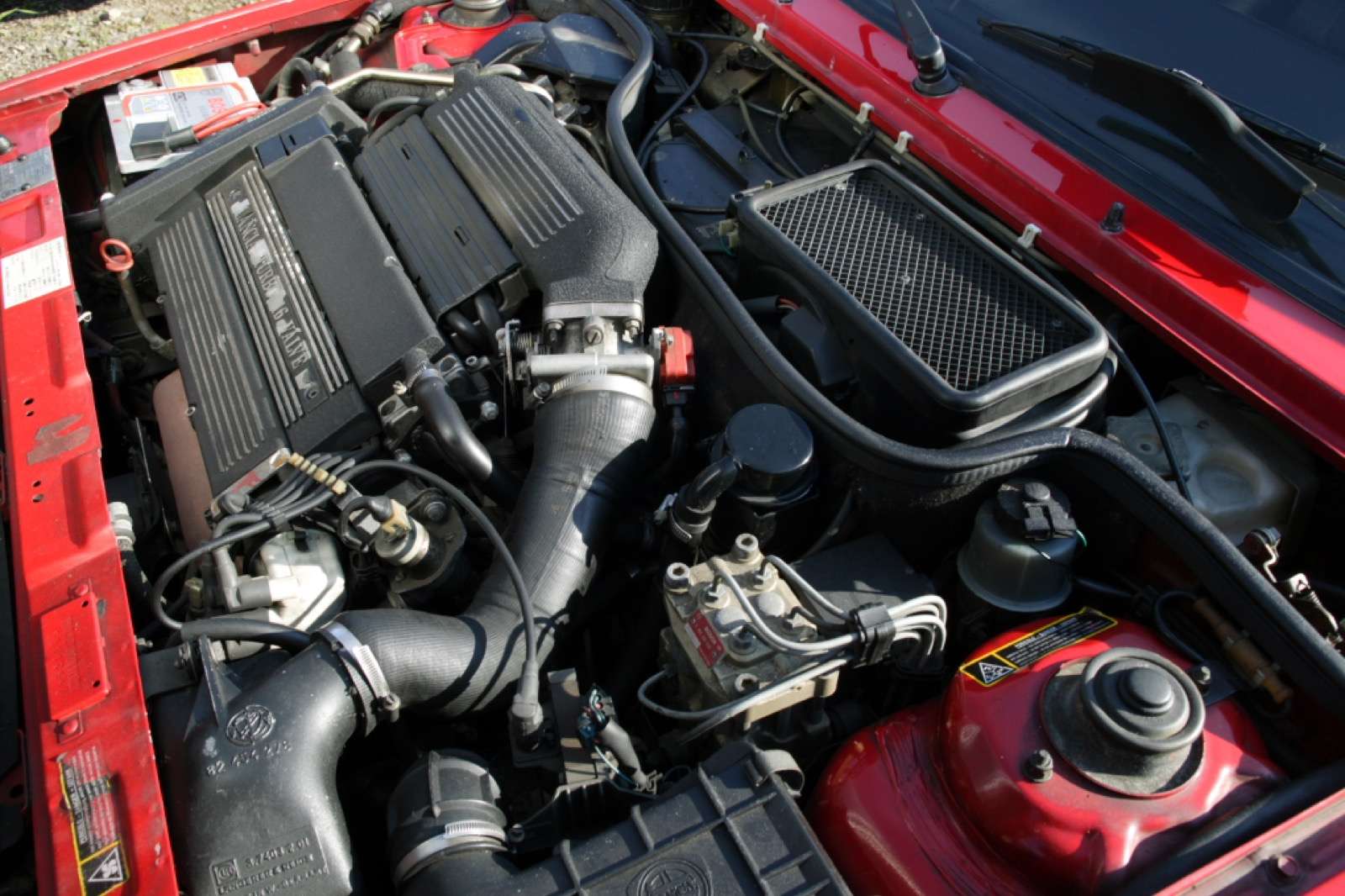Turbocharged 16-valve engine bay of a Lancia Delta HF Integrale