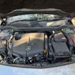Car engine bay illustrating vehicle-specific diagnostic scanner guides
