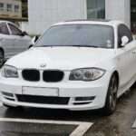 E82 120d fixed-roof Coupé, front three-quarter view