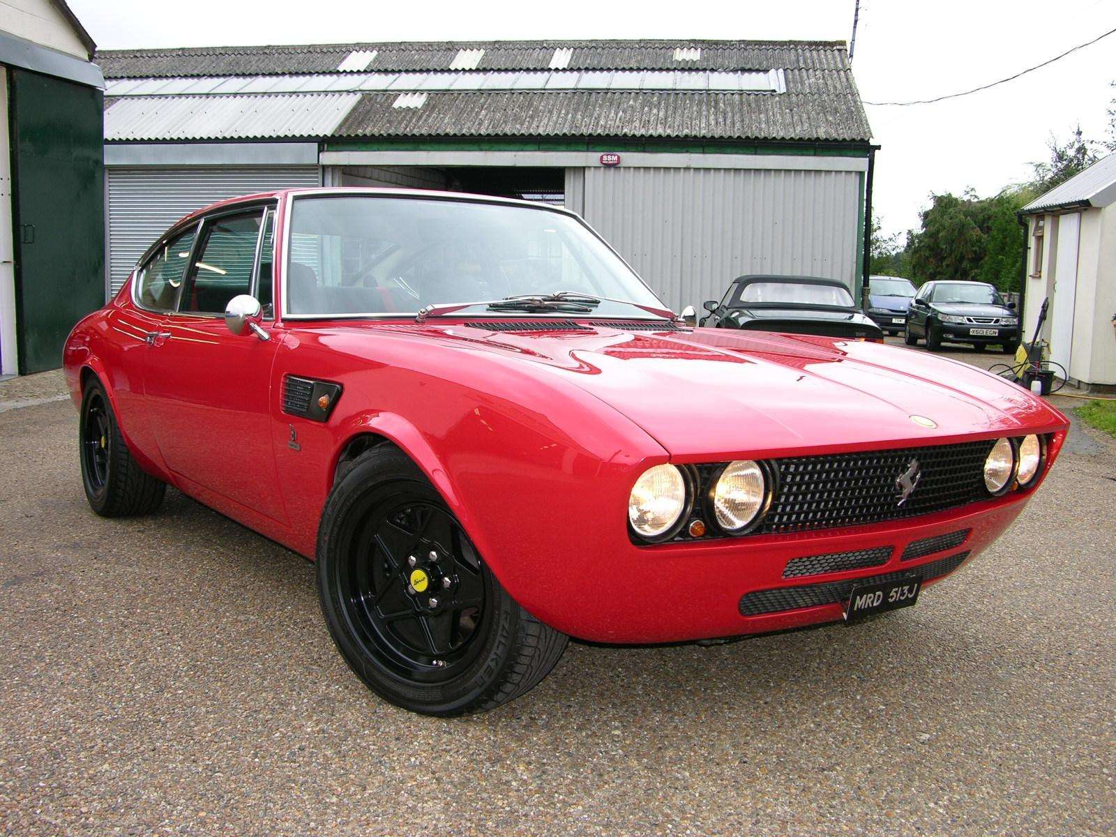 Red 1971 Fiat Dino Coupé viewed from the front