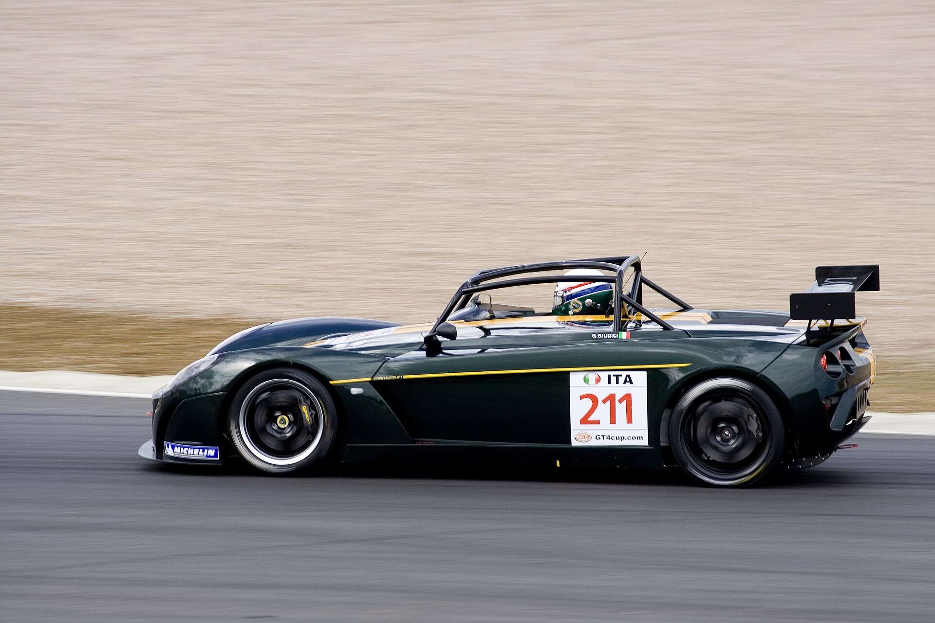 Lotus 2-Eleven GT4 race car on circuit