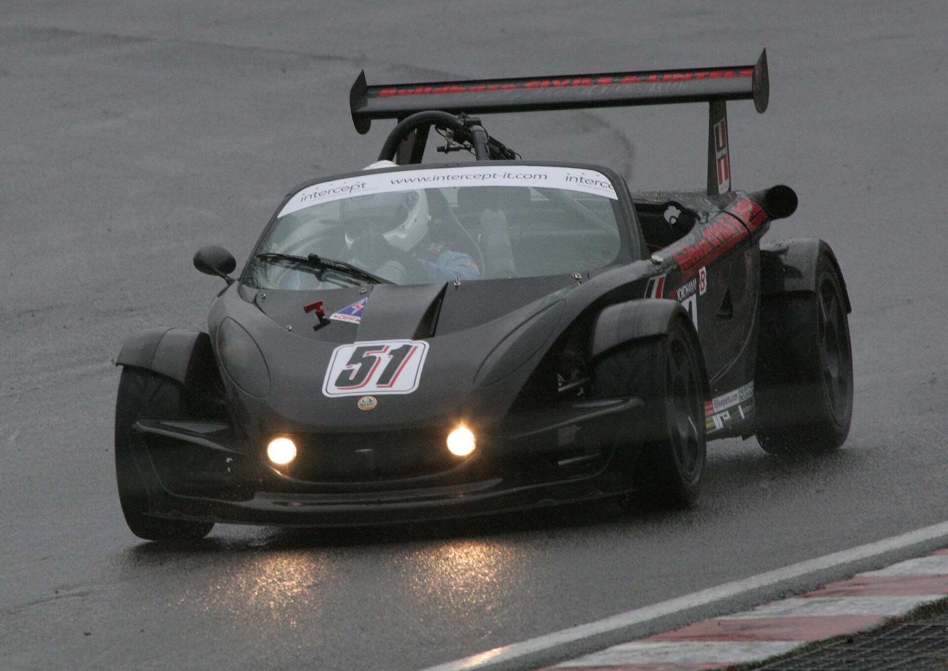 Lotus 340R competing on a wet circuit