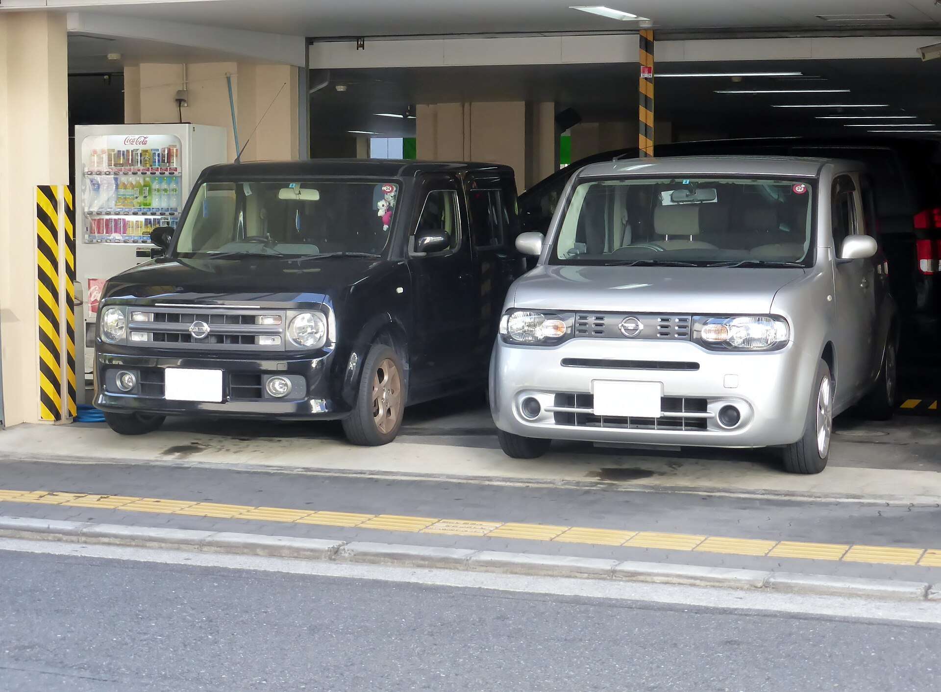 Nissan Cube Z11 and Z12 parked together front view