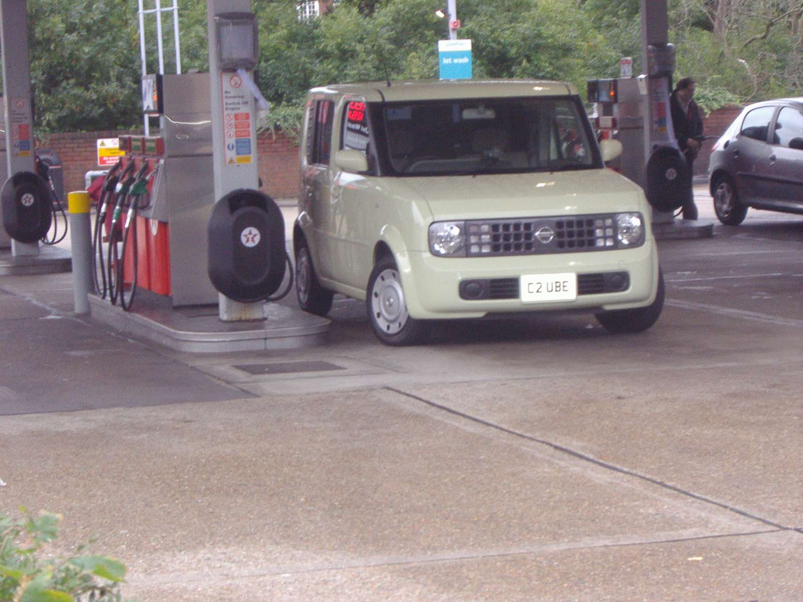 Silver Nissan Cube Z11 in England front three-quarter view