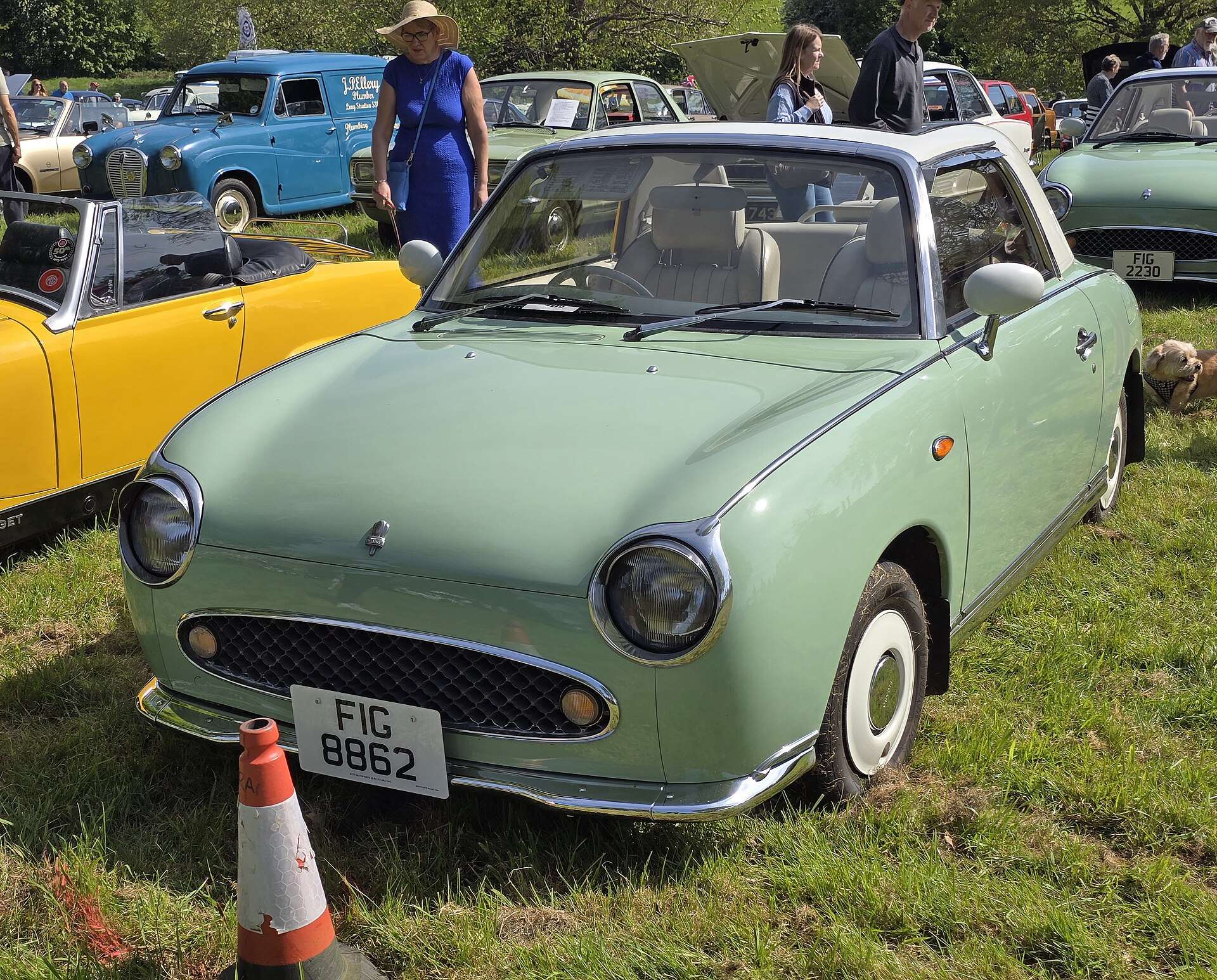 Pale green 1991 Nissan Figaro front three-quarter view