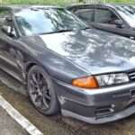 Gunmetal Nissan Skyline GT-R R32 front three-quarter view