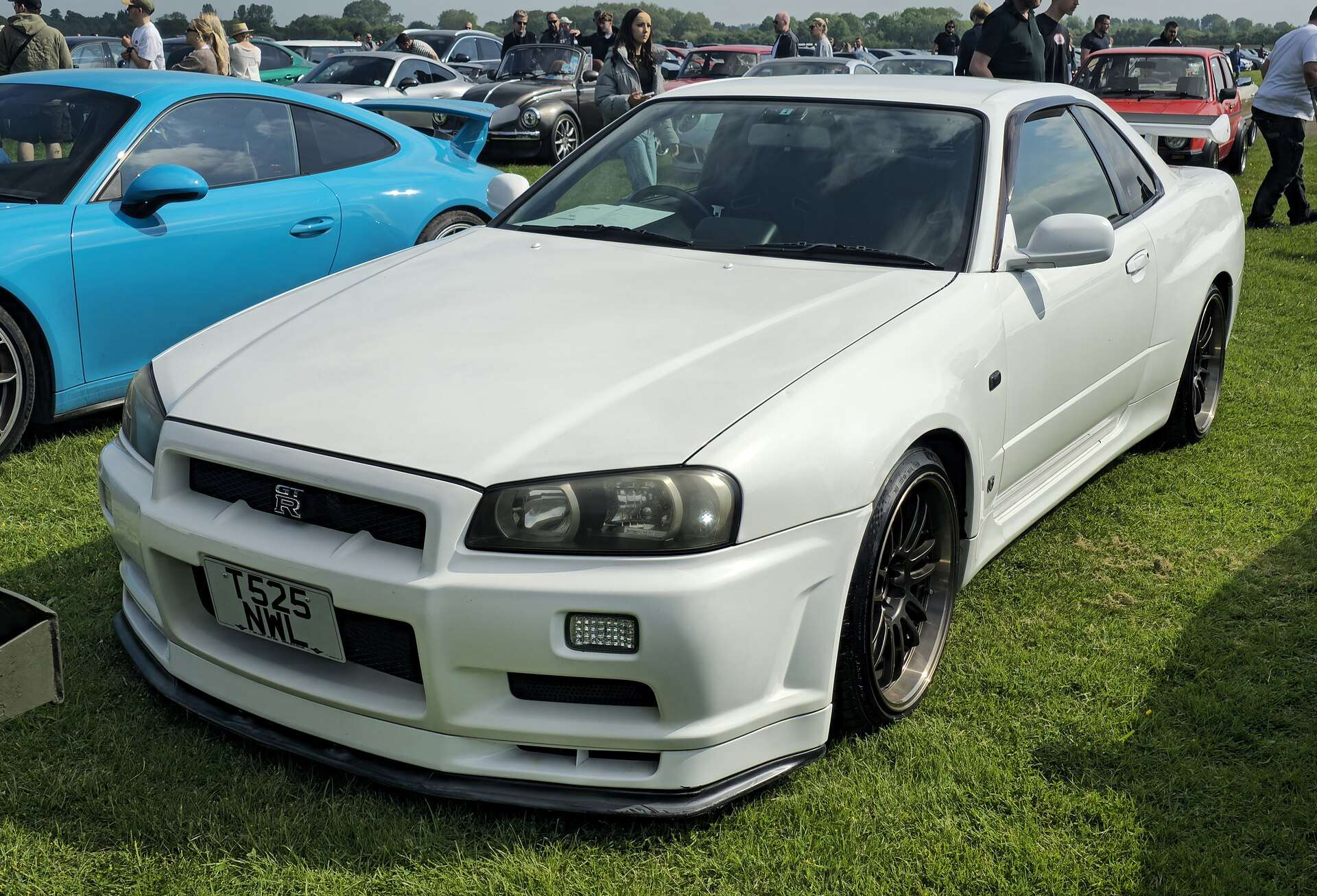White Nissan Skyline GT-R R34 V-Spec front three-quarter view