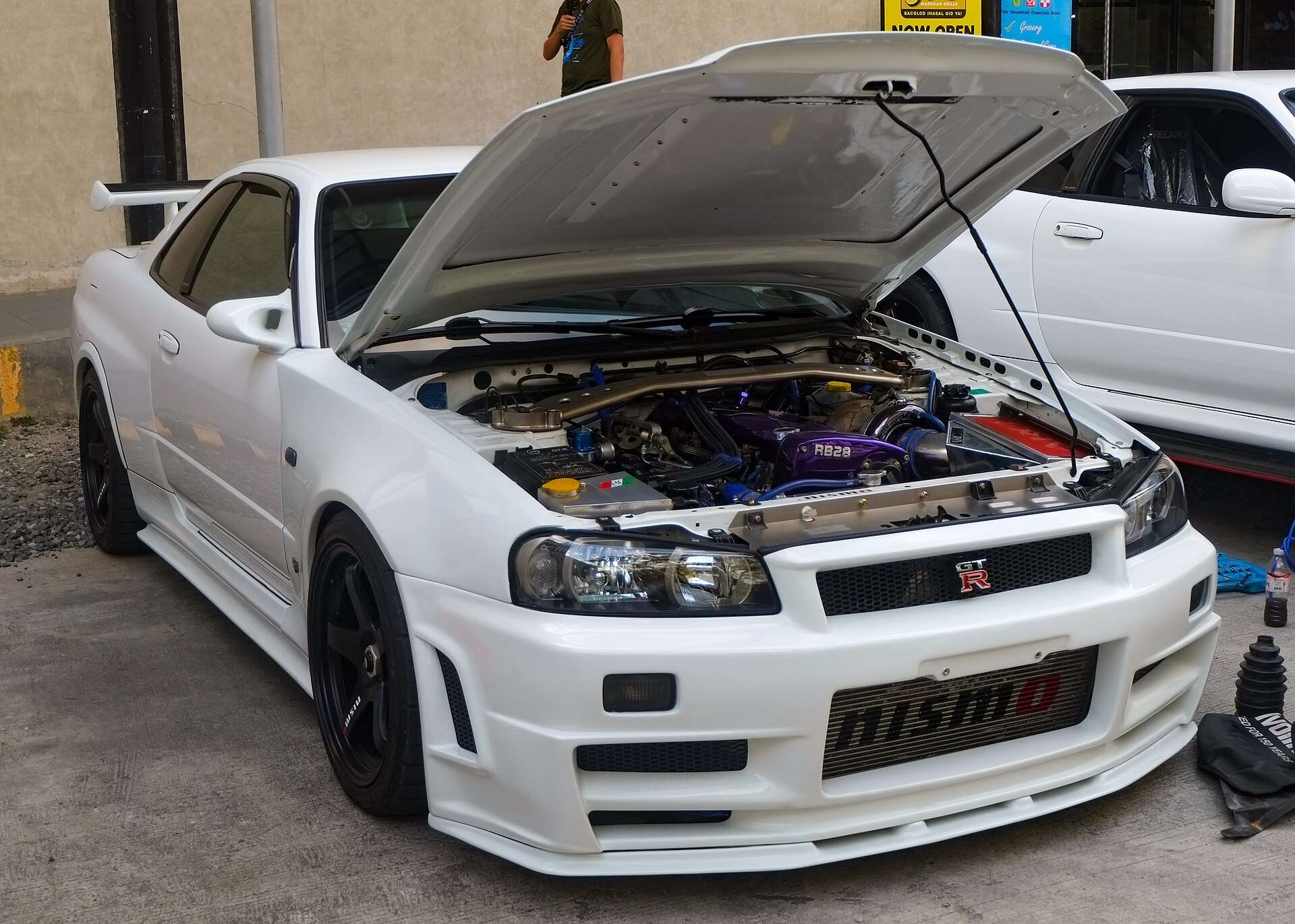 White Nissan Skyline GT-R R34 V-Spec with bonnet open