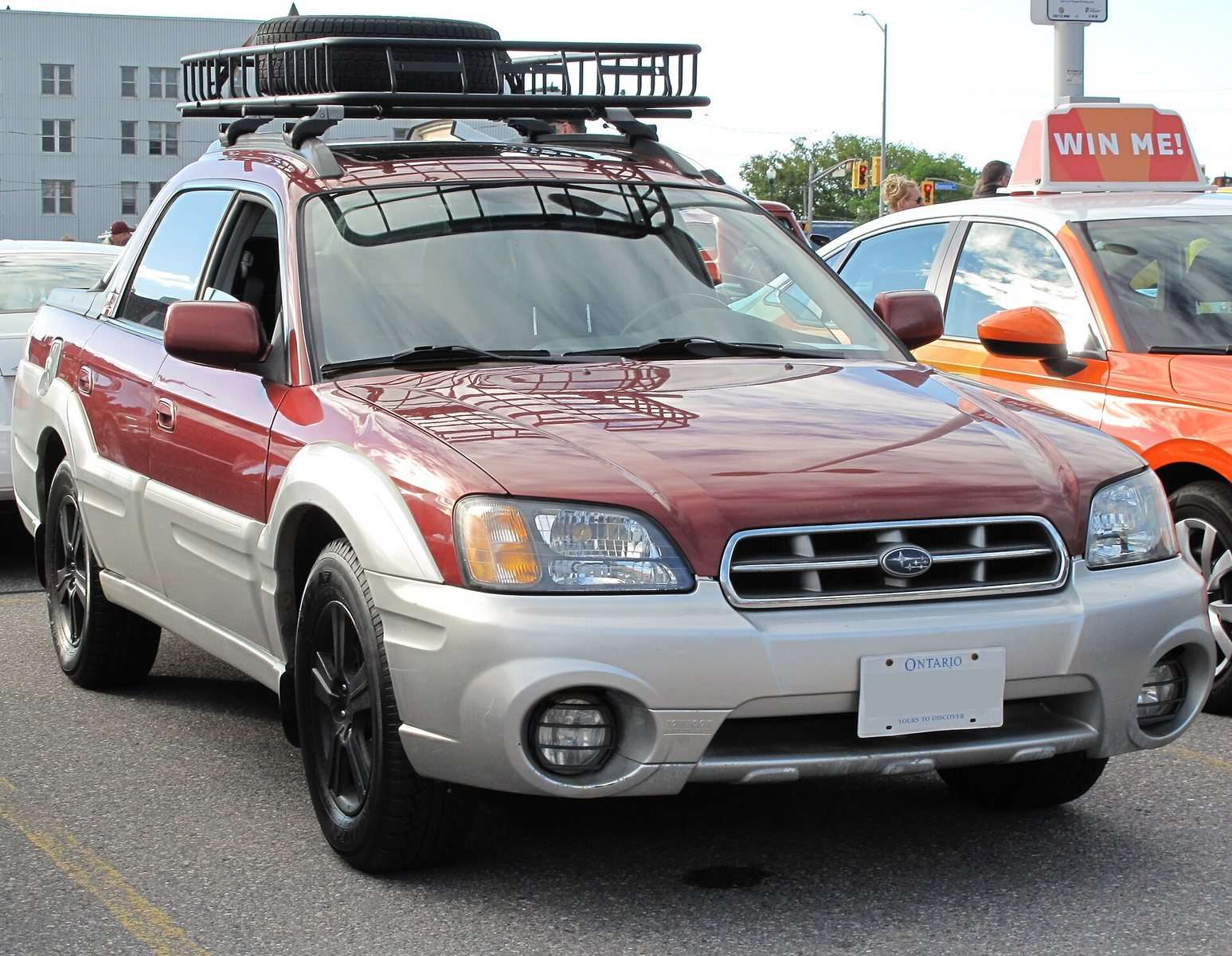 Red and silver Subaru Baja