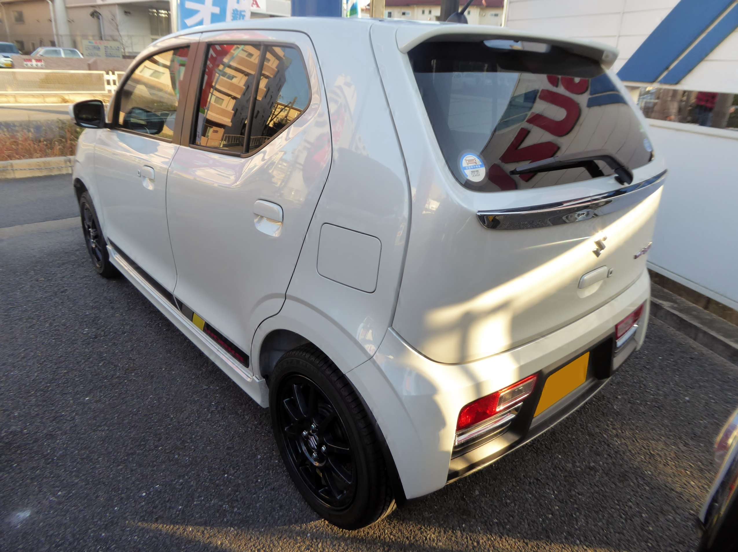 Rear three-quarter view of a silver Suzuki Alto Works HA36S