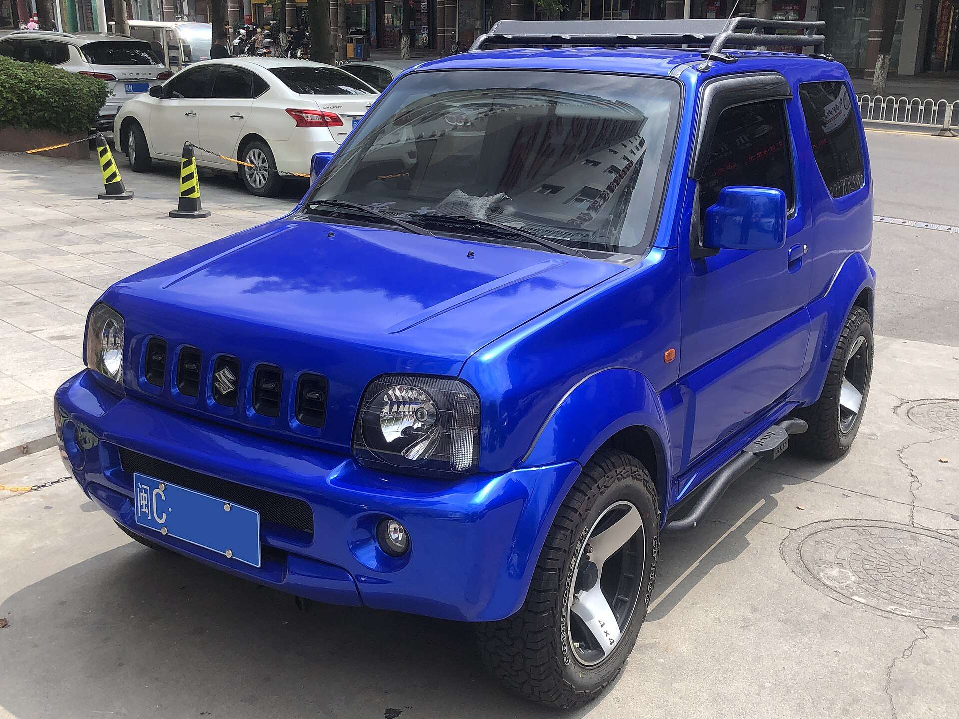 Third-generation Suzuki Jimny showing the coil-sprung body design