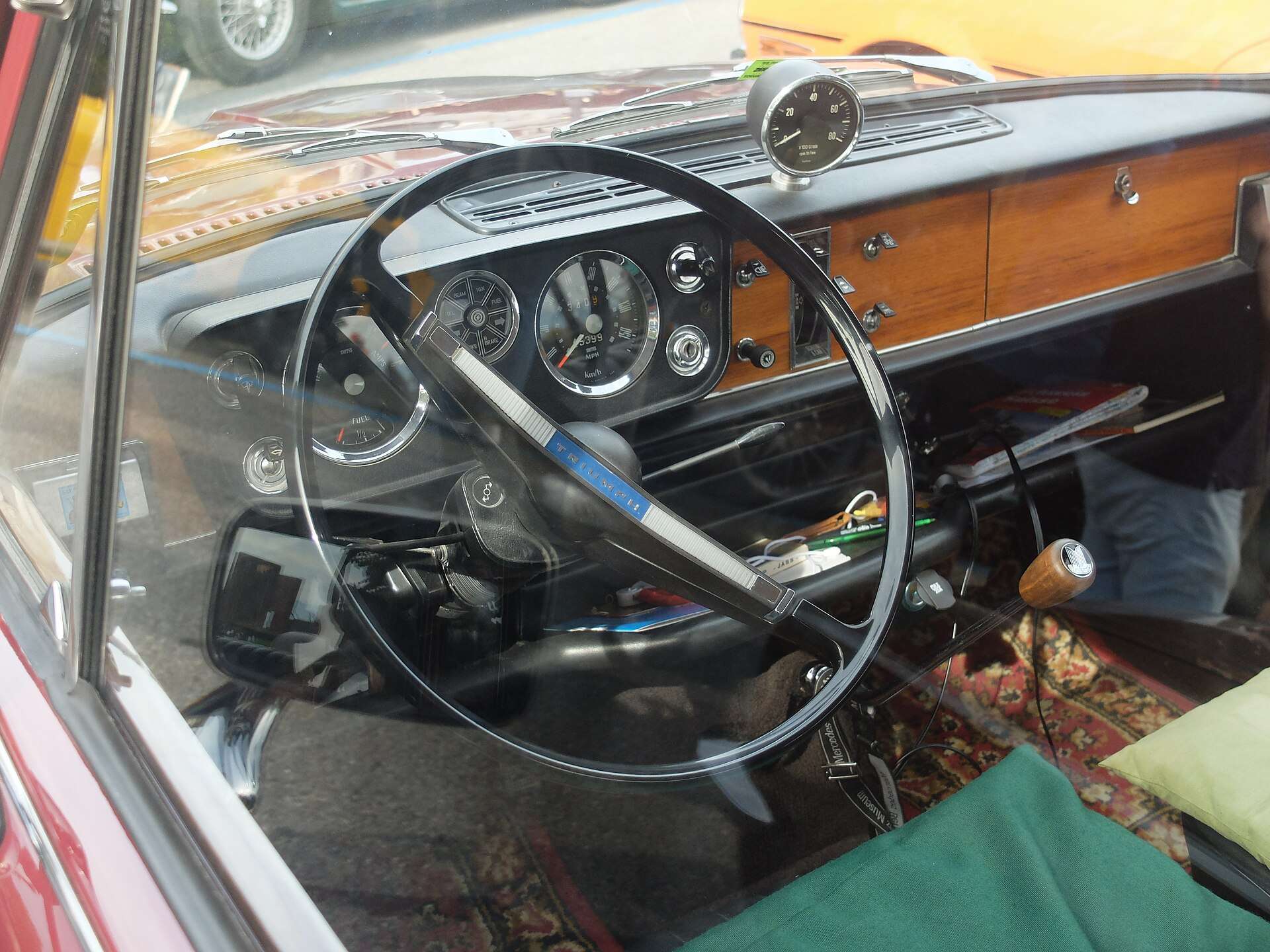 Triumph 1300 dashboard and wood-trimmed cabin