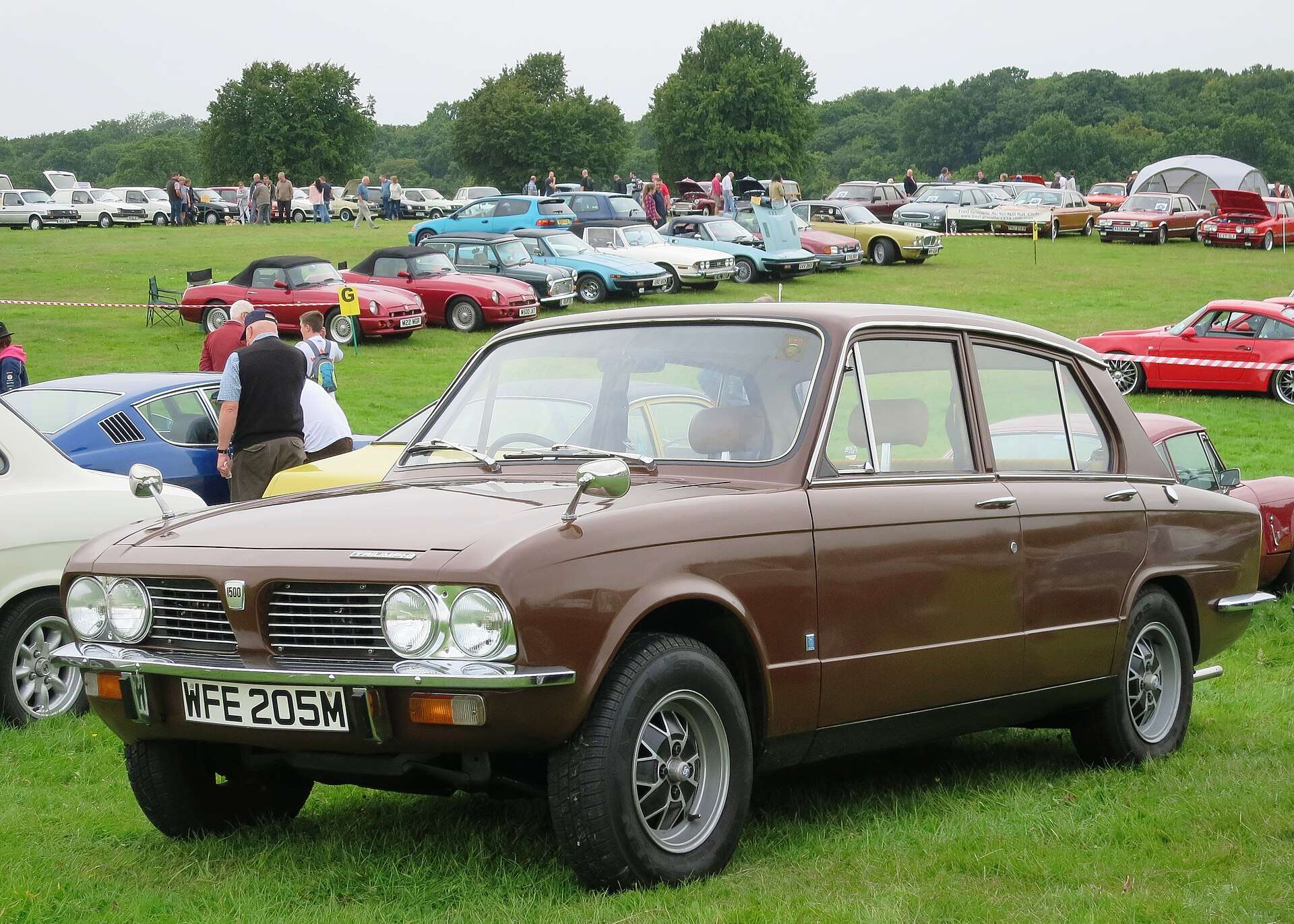 Brown rear-wheel-drive Triumph 1500TC front three-quarter view