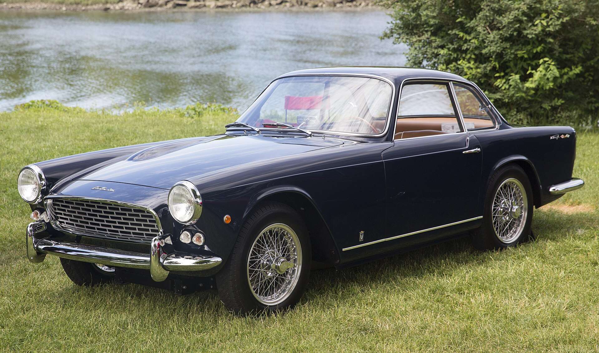 Midnight blue 1960 Triumph Italia 2000 GT front three-quarter view