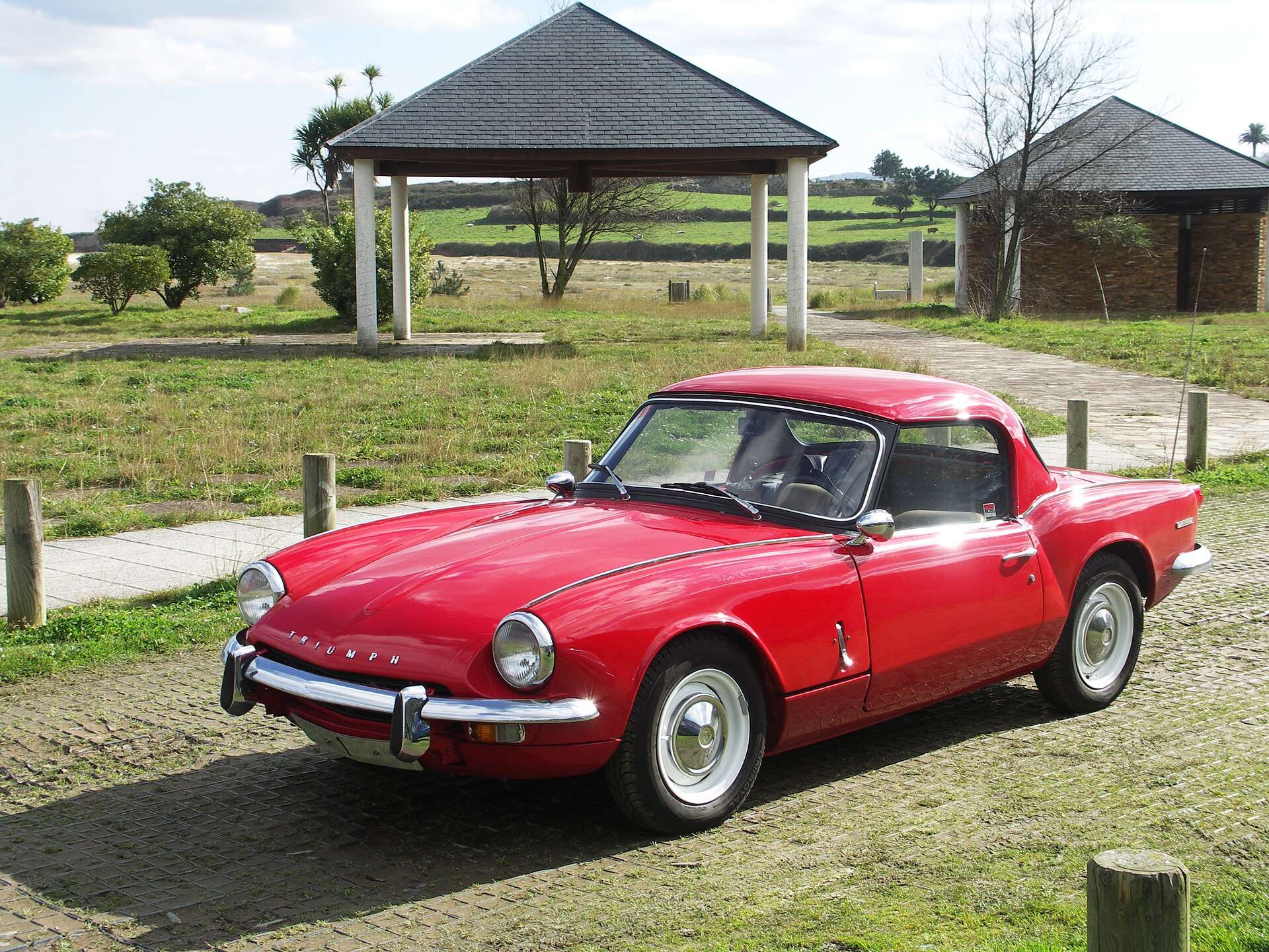 Red Triumph Spitfire Mk3 fitted with a winter hardtop