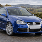 Blue Volkswagen Golf R32 Mk5 on a British country road — illustrative artwork