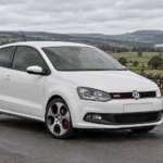 White Volkswagen Polo GTI 6R on a British country road — illustrative artwork